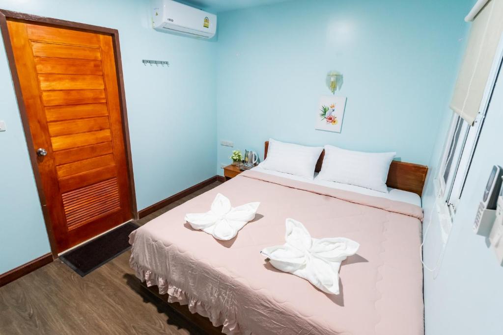Postel nebo postele na pokoji v ubytování Aladdin Guest House