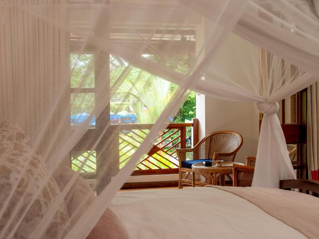 Postel nebo postele na pokoji v ubytování Le Colonial 1506 - Exclusive Luxury Hideaway