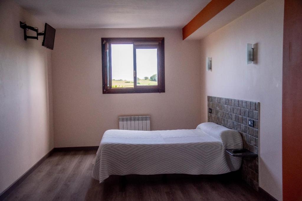 Postel nebo postele na pokoji v ubytování Gure ametsa
