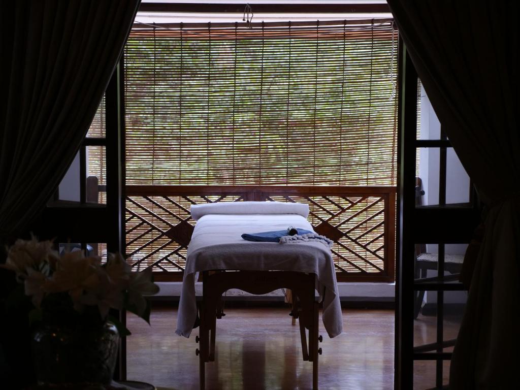 Postel nebo postele na pokoji v ubytování Le Colonial 1506 - Exclusive Luxury Hideaway
