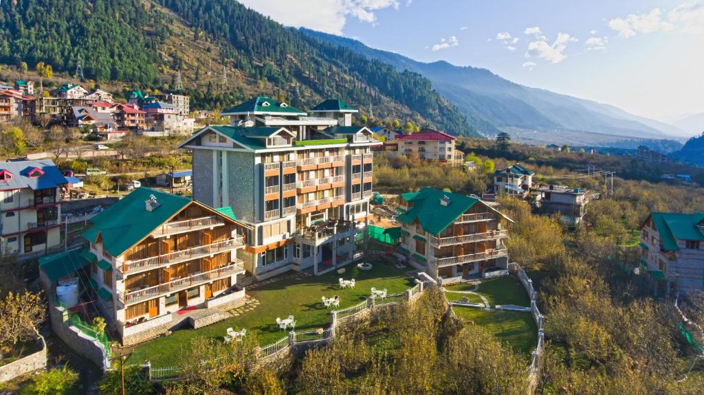 an aerial view of a resort in the mountains at The Whitestone Resorts in Manāli