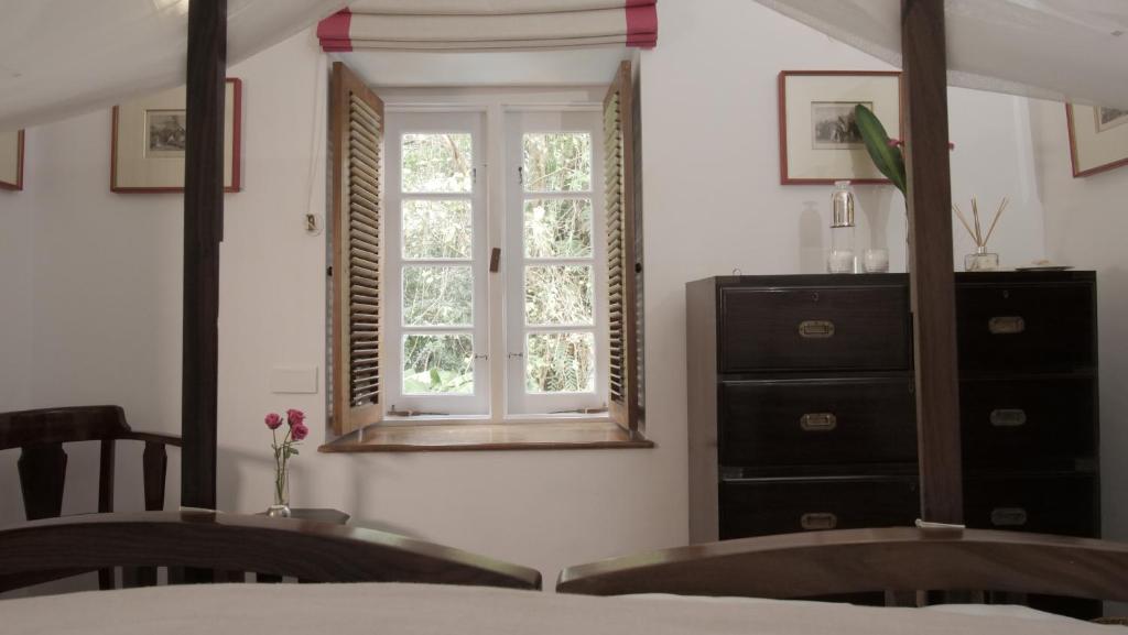 Postel nebo postele na pokoji v ubytování Le Colonial 1506 - Exclusive Luxury Hideaway