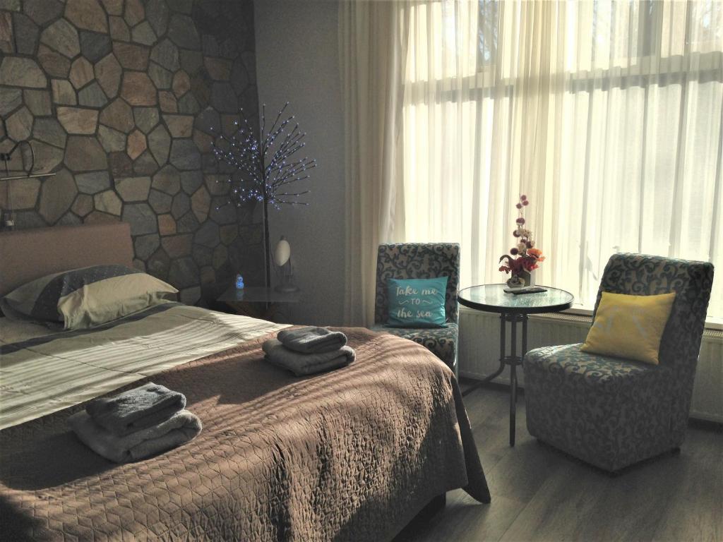 Postel nebo postele na pokoji v ubytování Westerschelde B&B