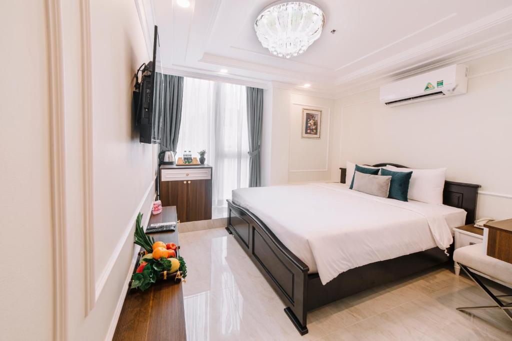 Giường trong phòng chung tại Saigon Hanoi Central Hotel