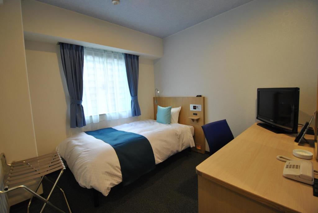 Postel nebo postele na pokoji v ubytování Hotel Mark-1 Tsukuba
