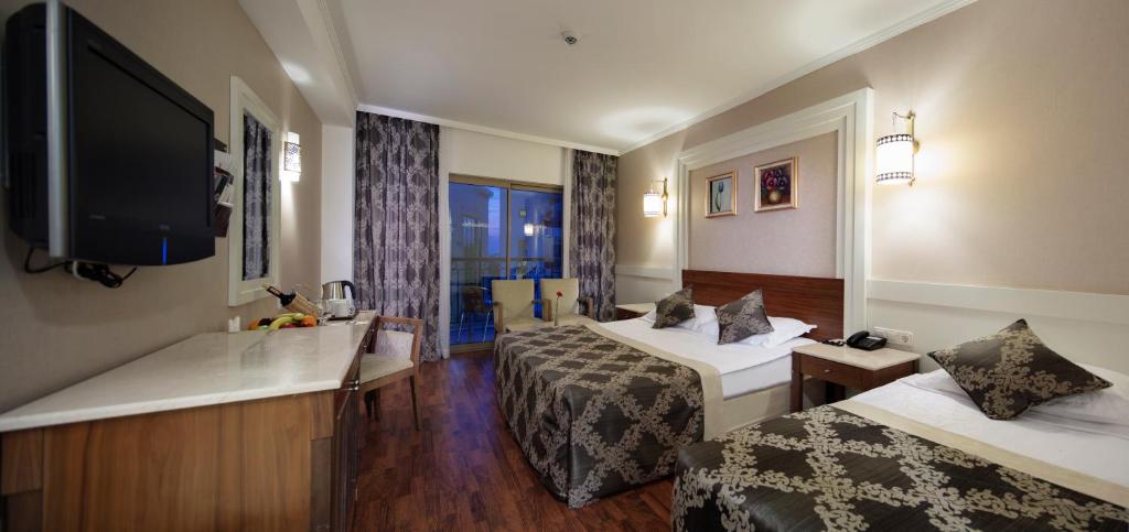 Postel nebo postele na pokoji v ubytování Alba Queen Hotel - Ultra All Inclusive