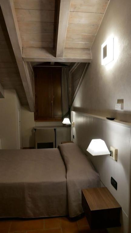 Postel nebo postele na pokoji v ubytování Hotel La Valle