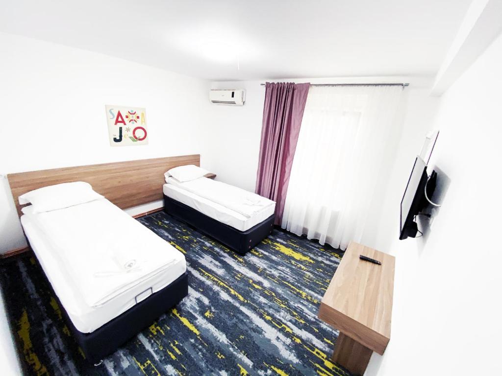 Postel nebo postele na pokoji v ubytování Hotel Suljovic