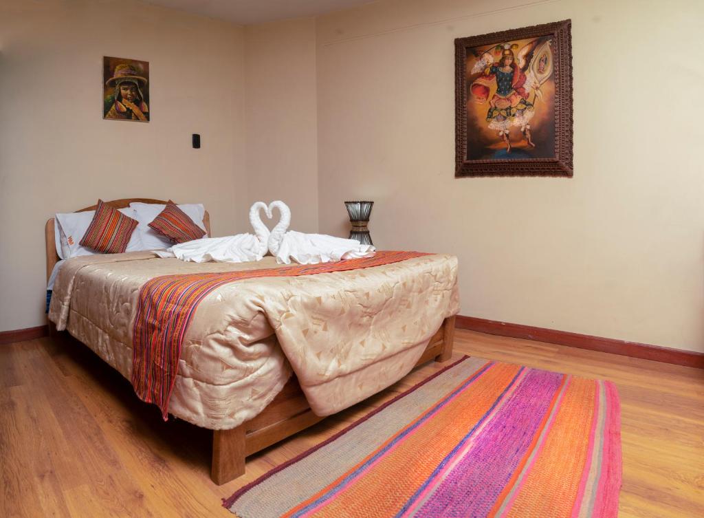 Postel nebo postele na pokoji v ubytování Hotel Melanys