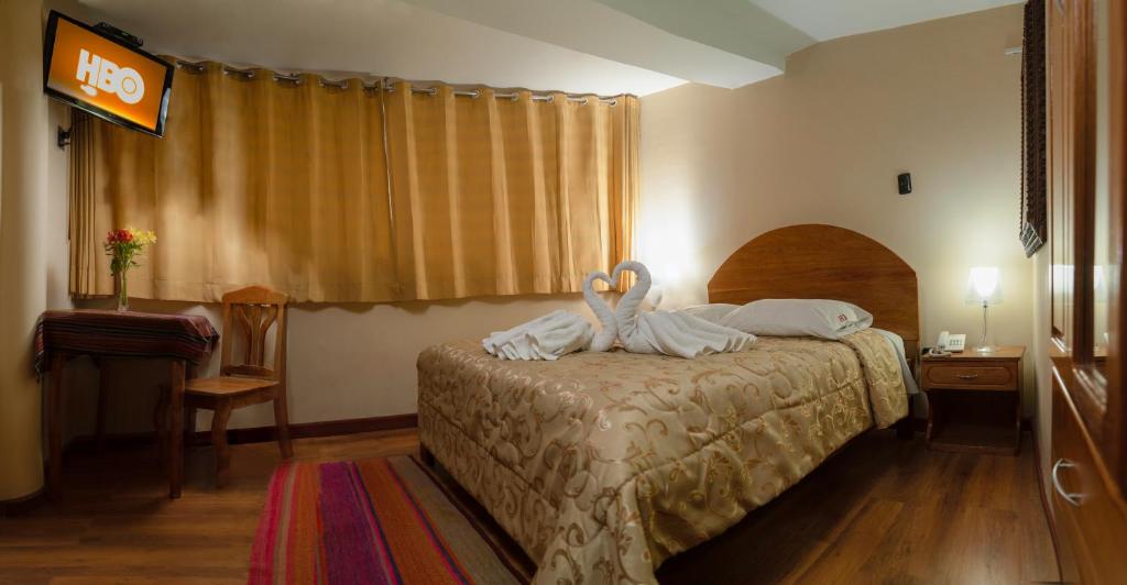 Postel nebo postele na pokoji v ubytování Hotel Melanys