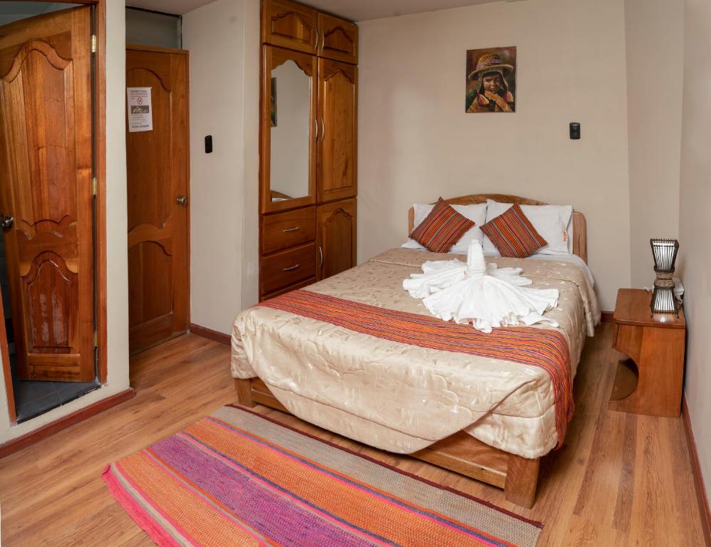 Postel nebo postele na pokoji v ubytování Hotel Melanys