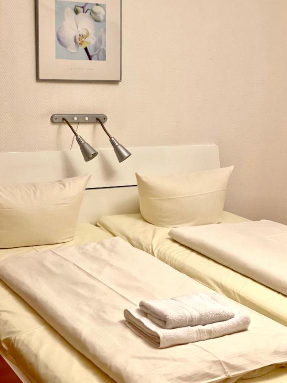 Postel nebo postele na pokoji v ubytování Hotel Arena Rooms - Berlin Mitte