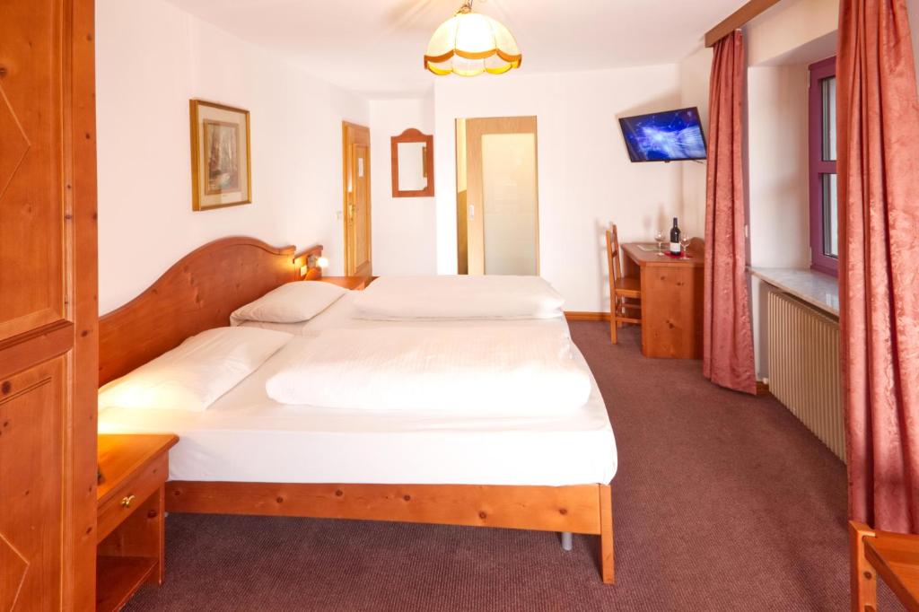 Postel nebo postele na pokoji v ubytování Pension & Residence Astoria