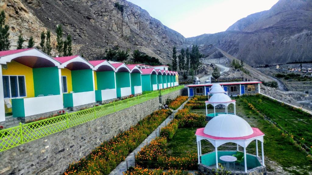a row of houses on the side of a mountain at Hotel Mountain Lodge Skardu in Skardu