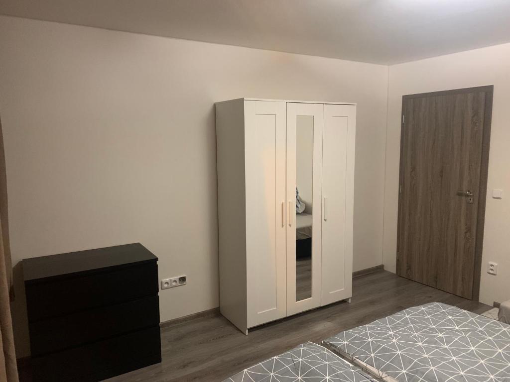Posteľ alebo postele v izbe v ubytovaní Penzion Fortuna Žatec