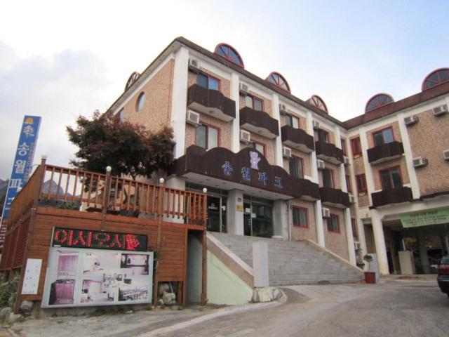 a building with a staircase on the side of it at Songwol Park in Sokcho