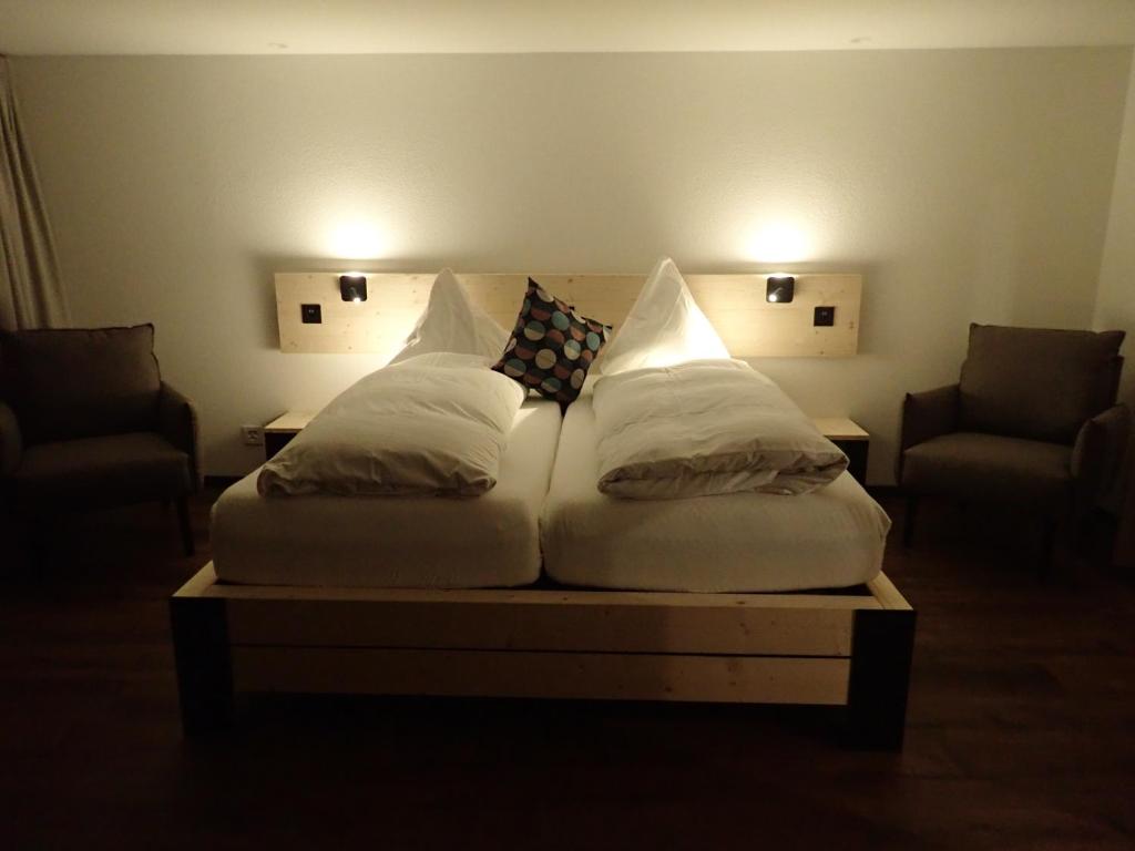 Postel nebo postele na pokoji v ubytování Hotel Furka