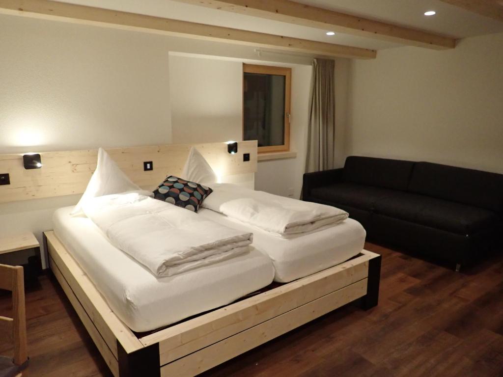 Posteľ alebo postele v izbe v ubytovaní Hotel Furka