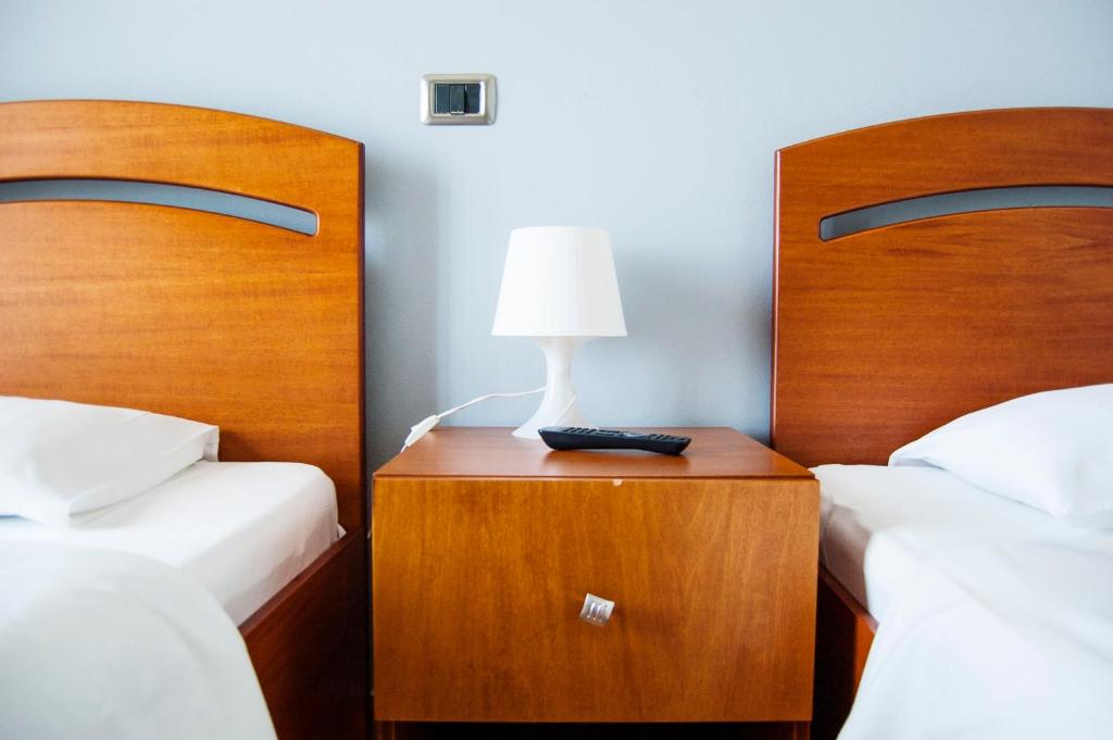 Postel nebo postele na pokoji v ubytování Dhima Hotel