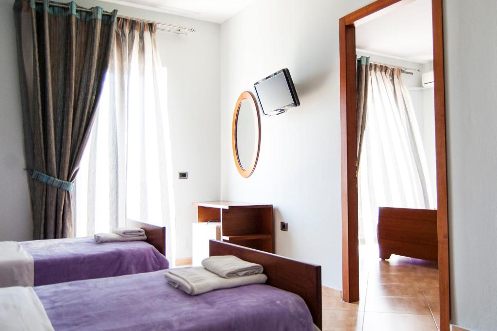 Postel nebo postele na pokoji v ubytování Dhima Hotel
