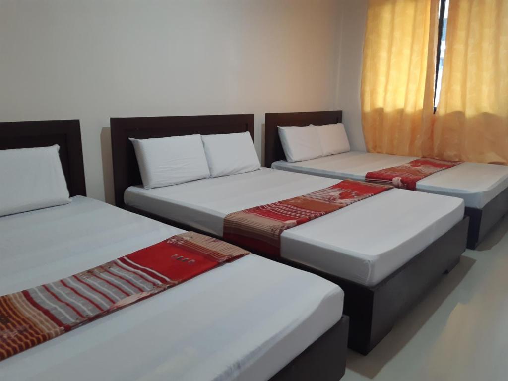 Ένα ή περισσότερα κρεβάτια σε δωμάτιο στο Veance Travellers Inn-Pabuas extension