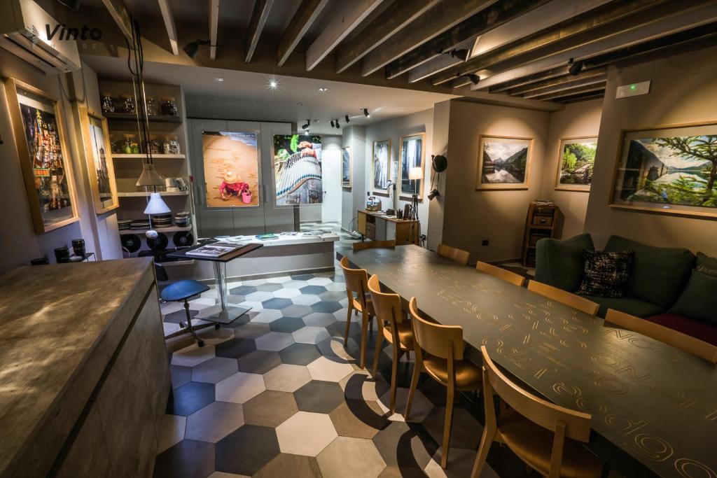 a bar with chairs and a table in a room at Vinto House Salerno Downtown in Salerno