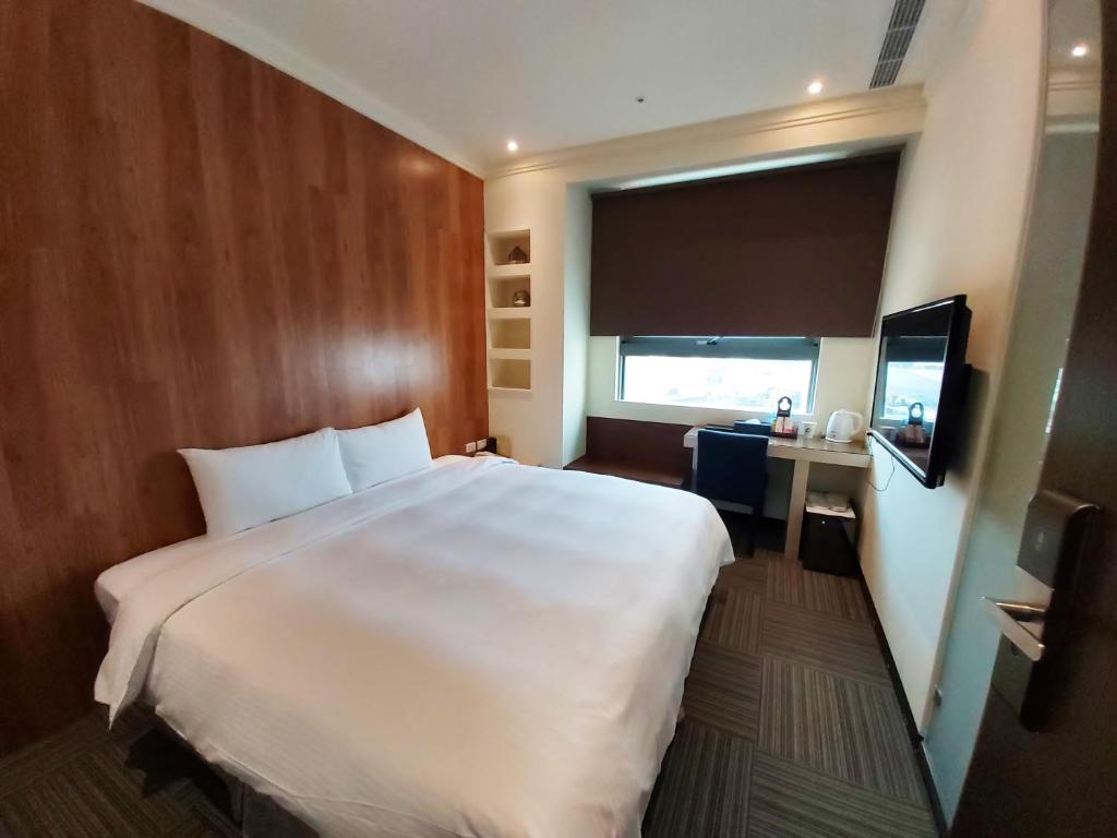 Postel nebo postele na pokoji v ubytování Merryday Hotel Banqiao