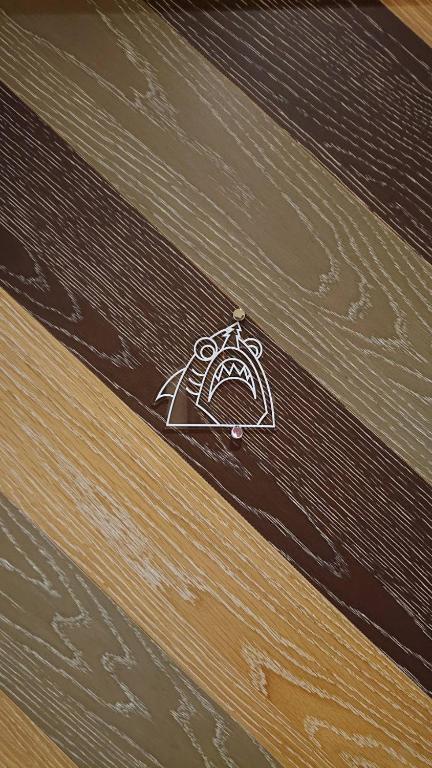 a drawing of a diamond on a wooden table at Shark B&B in Hengchun