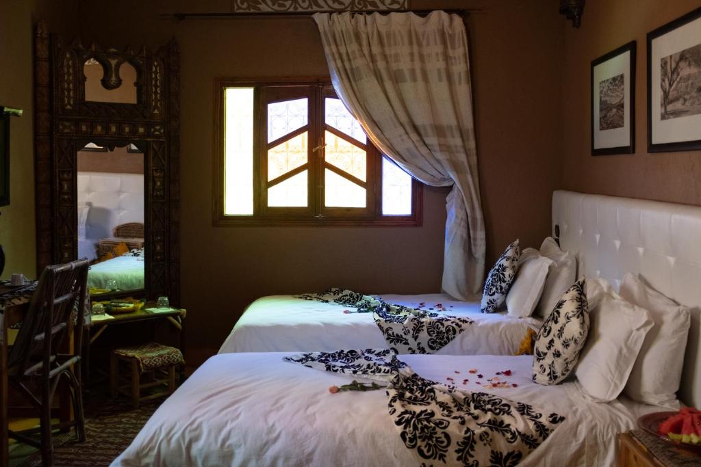 Un ou plusieurs lits dans un hébergement de l'établissement Riad Ouarzazate