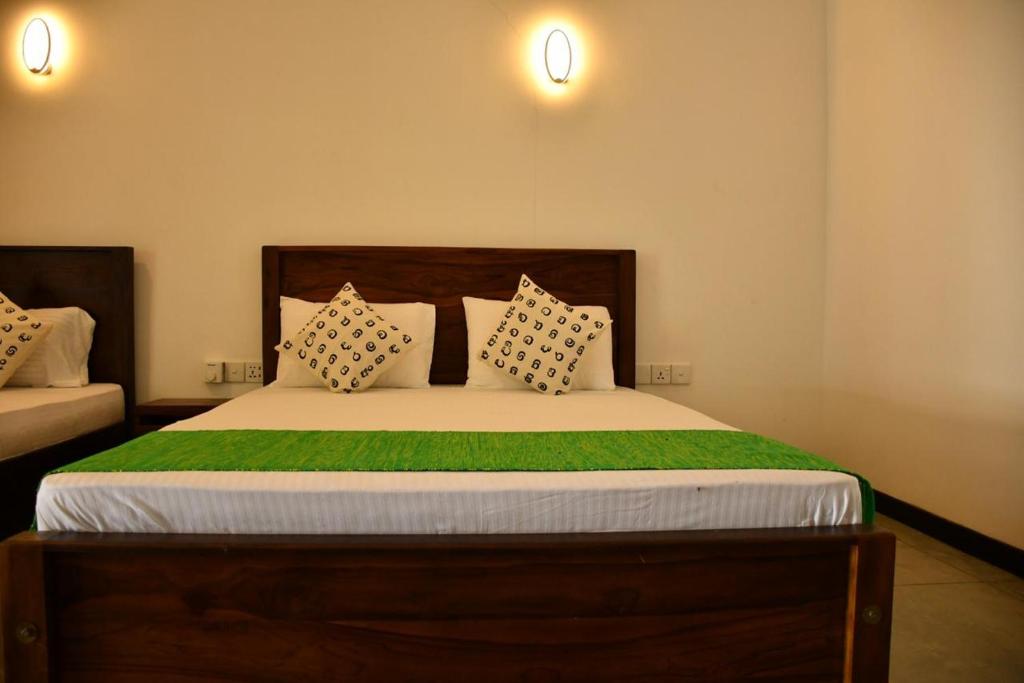 Postel nebo postele na pokoji v ubytování Buddika Safari & Resort