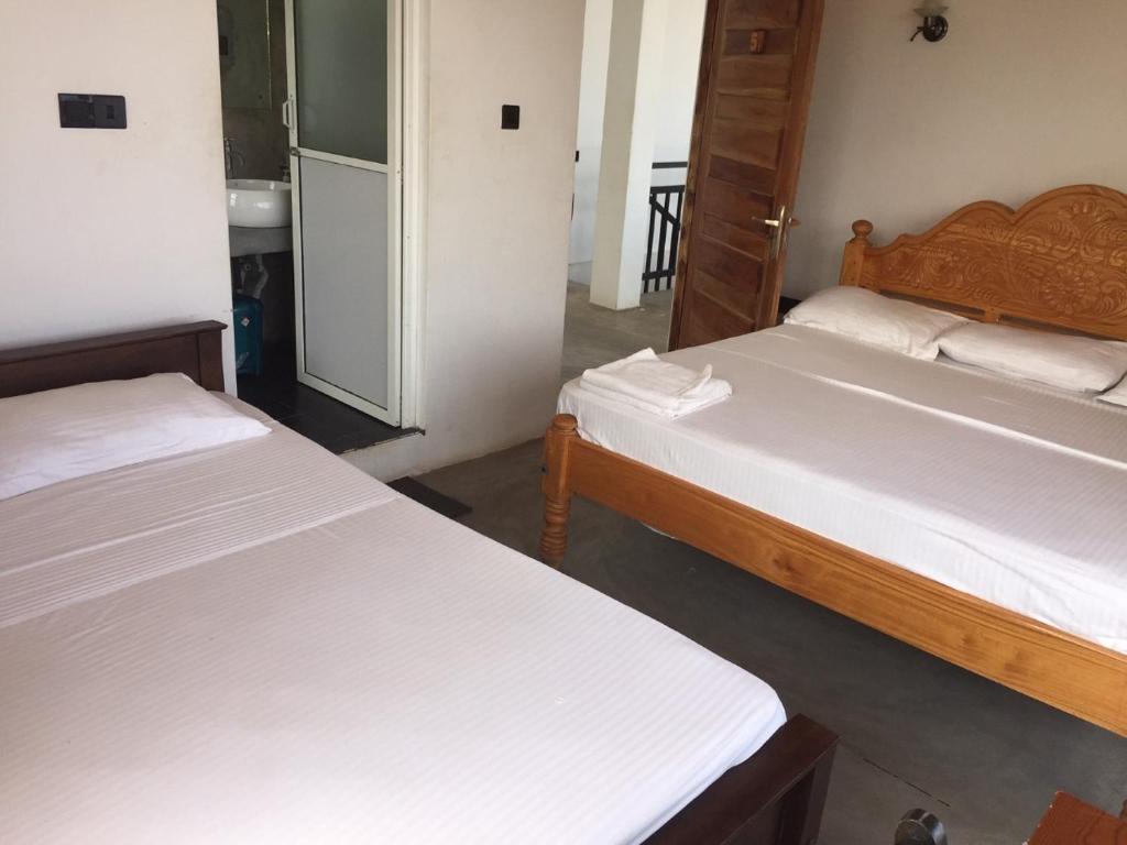 Postel nebo postele na pokoji v ubytování Hotel Tobiko
