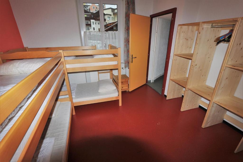 Postel nebo postele na pokoji v ubytování juhui Arosa