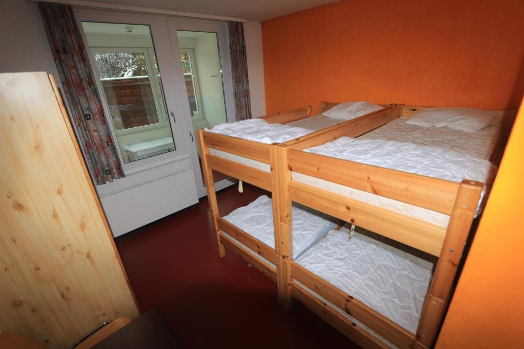 Postel nebo postele na pokoji v ubytování juhui Arosa