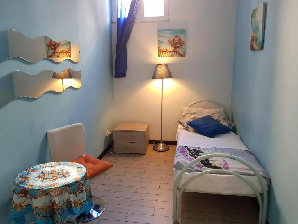 Postel nebo postele na pokoji v ubytování Family Hostel Milano
