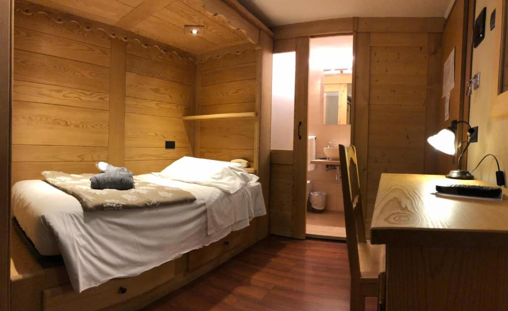 Łóżko lub łóżka w pokoju w obiekcie Hotel Edelweiss 3 Stelle SUPERIOR