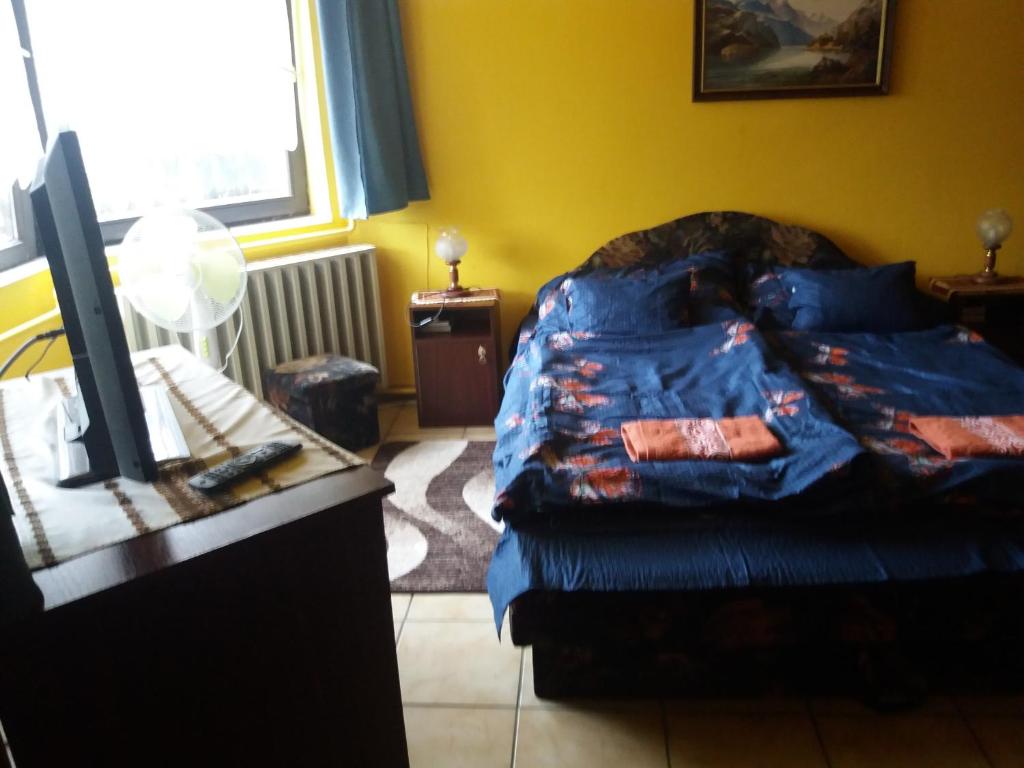 Postel nebo postele na pokoji v ubytování Lillafüred Kapuja Hotel