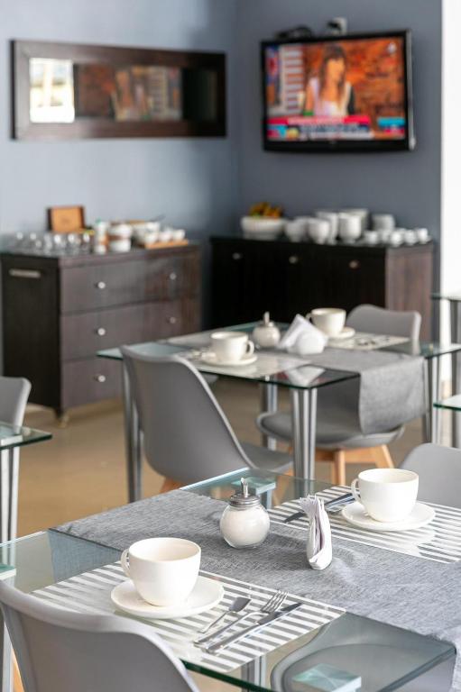 TV a/nebo společenská místnost v ubytování Urbano Hotel