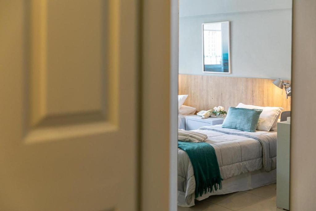 Postel nebo postele na pokoji v ubytování Urbano Hotel