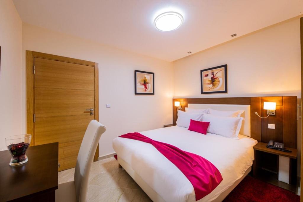 Postel nebo postele na pokoji v ubytování Appart-hotel Marrakech Inn