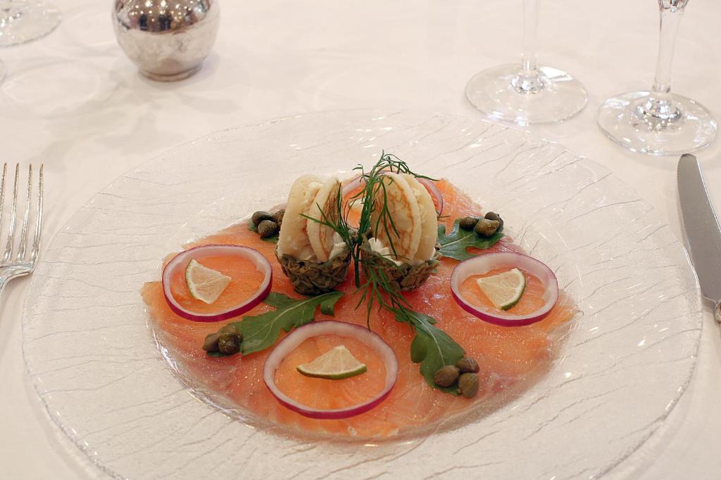 a plate of food with fruit and vegetables on a table at Hotel Meyer in Beaufort