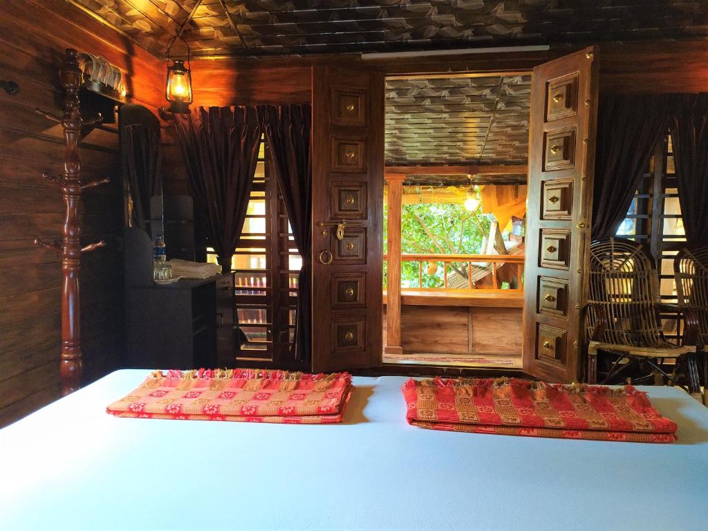 Postel nebo postele na pokoji v ubytování Sea Hut Homestay