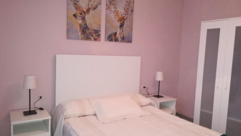 Posteľ alebo postele v izbe v ubytovaní P.B. Apartamento