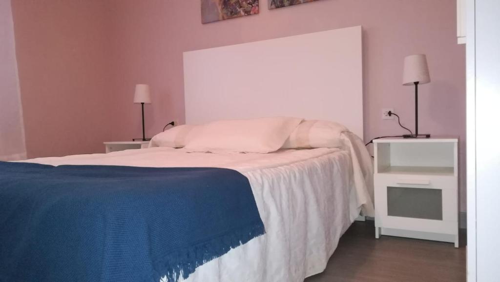 Posteľ alebo postele v izbe v ubytovaní P.B. Apartamento
