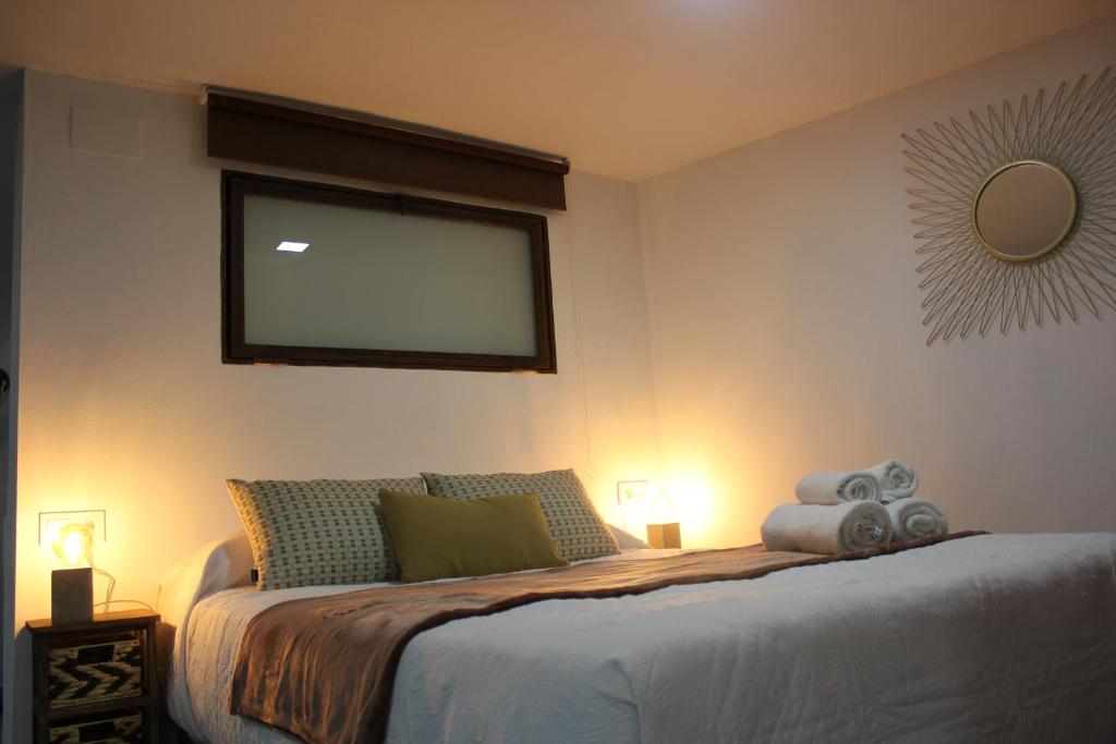 A bed or beds in a room at Loft Turístico en casco histórico, Wifi y TV satélite gratis