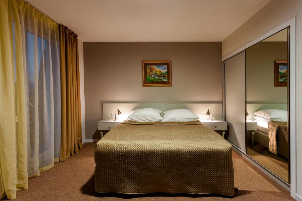 Postel nebo postele na pokoji v ubytování Hotel ZP Palace