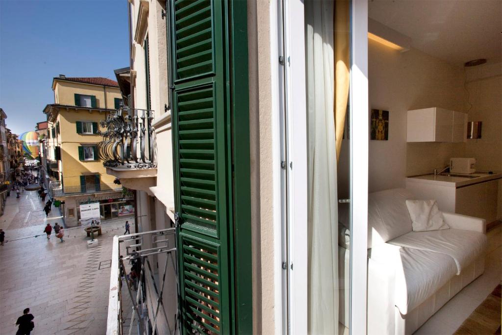 Postel nebo postele na pokoji v ubytování Opera Relais De Charme - Aparthotel