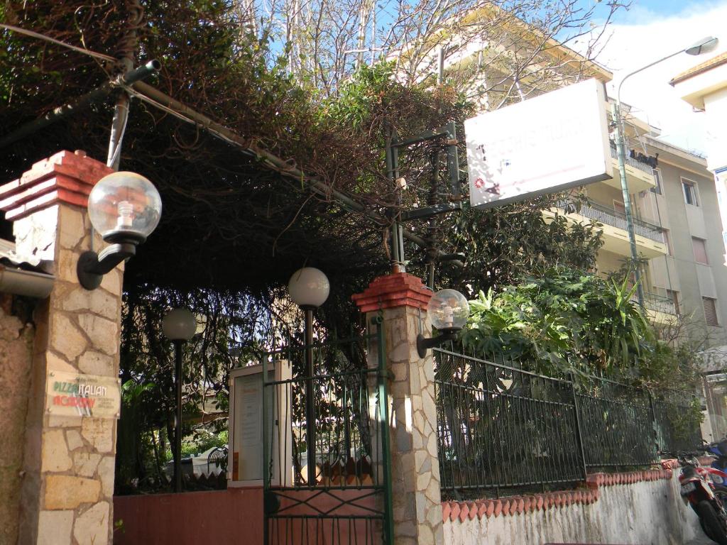 a house with a gate and a street light at Vecchie Mura in Varazze