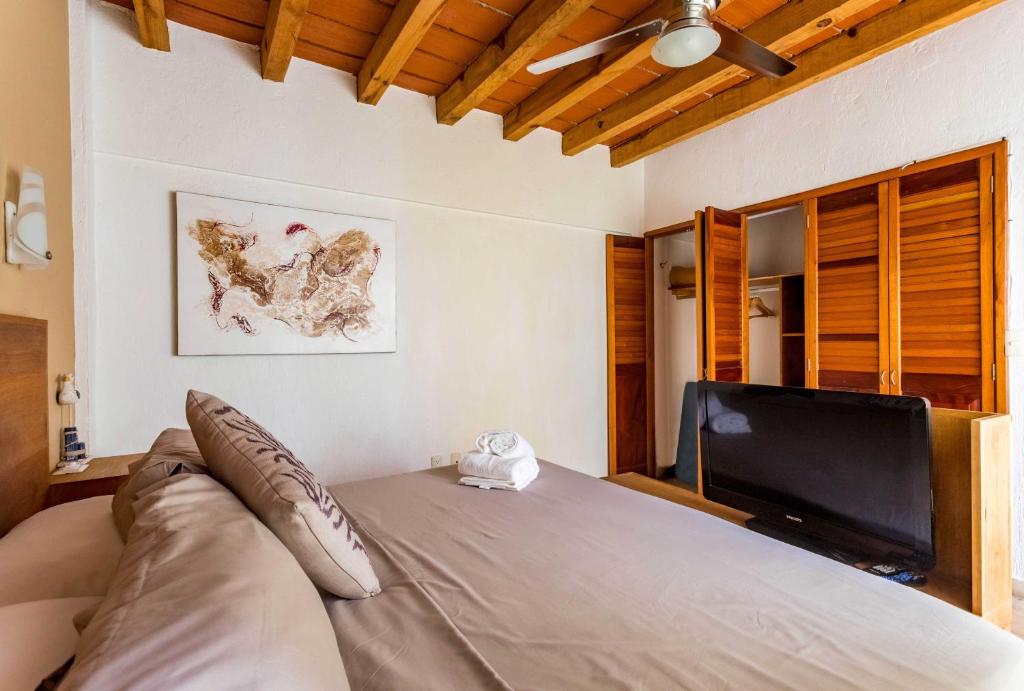 Postel nebo postele na pokoji v ubytování Olas Altas Suites Departamentos