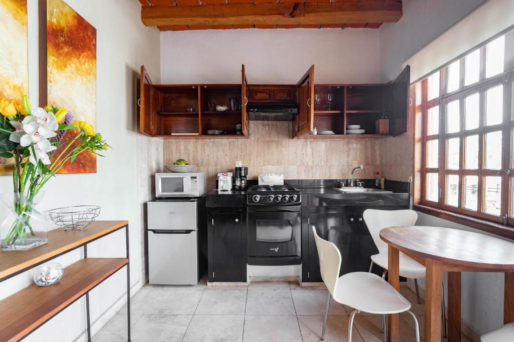Kuchyň nebo kuchyňský kout v ubytování Olas Altas Suites Departamentos