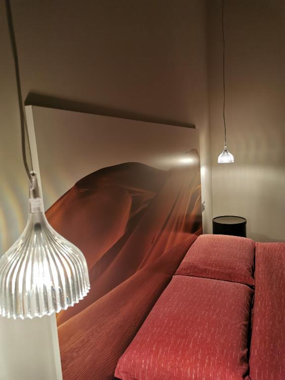 A bed or beds in a room at Il Microcosmo